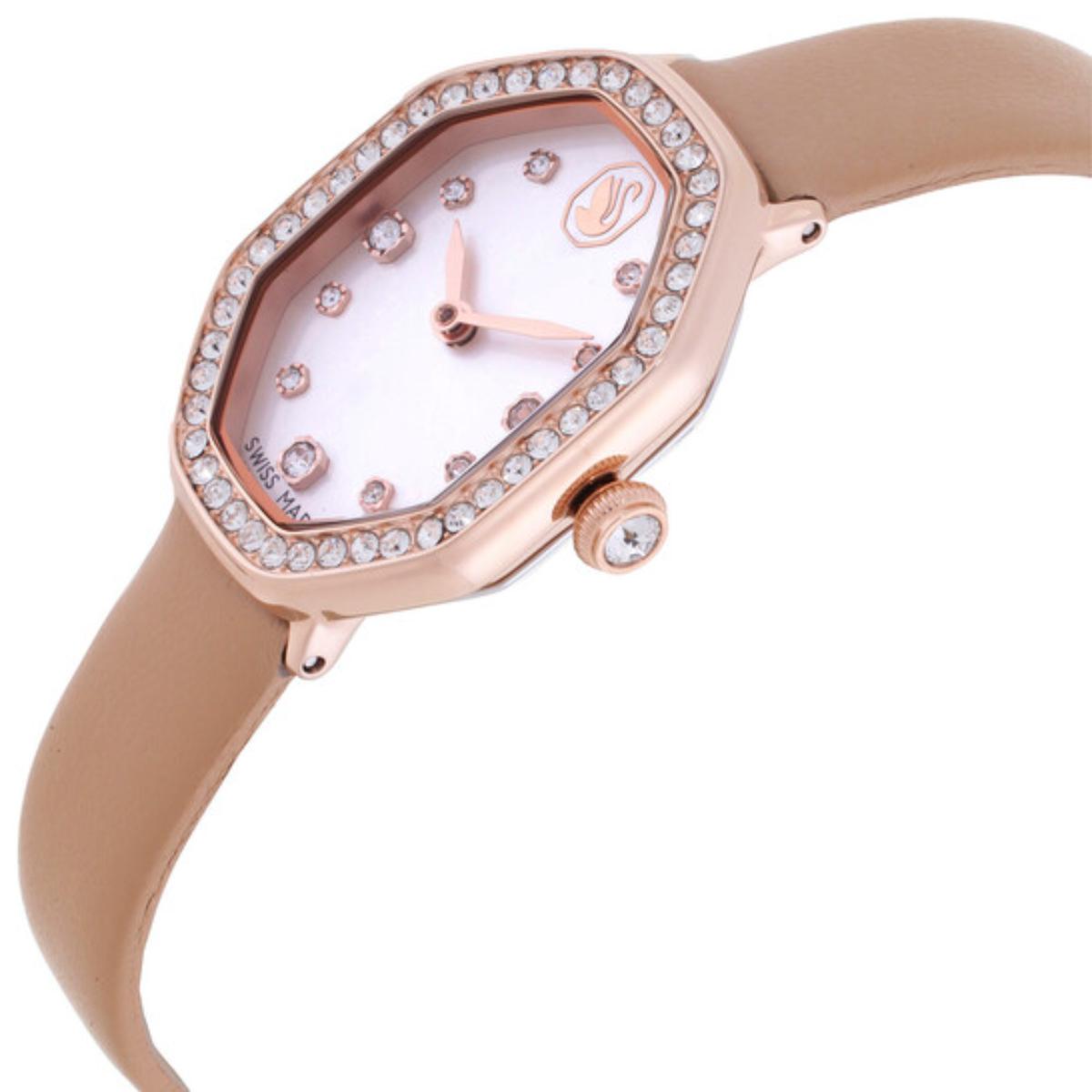 Watch with rose gold case and beige strap on a white background