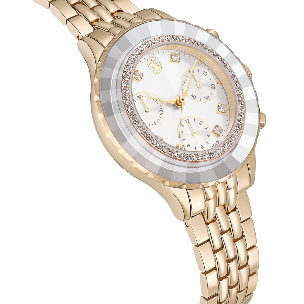 Gold wristwatch with a detailed face on a white background