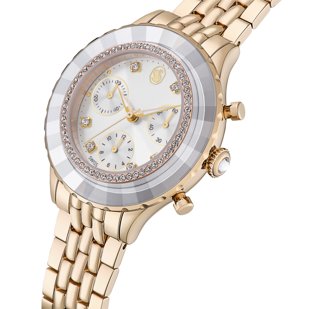 Gold wristwatch with a detailed face on a white background