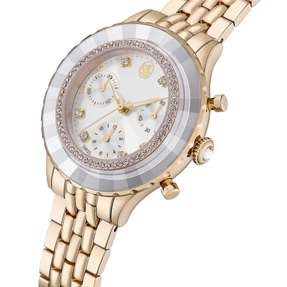 Gold wristwatch with a detailed face on a white background