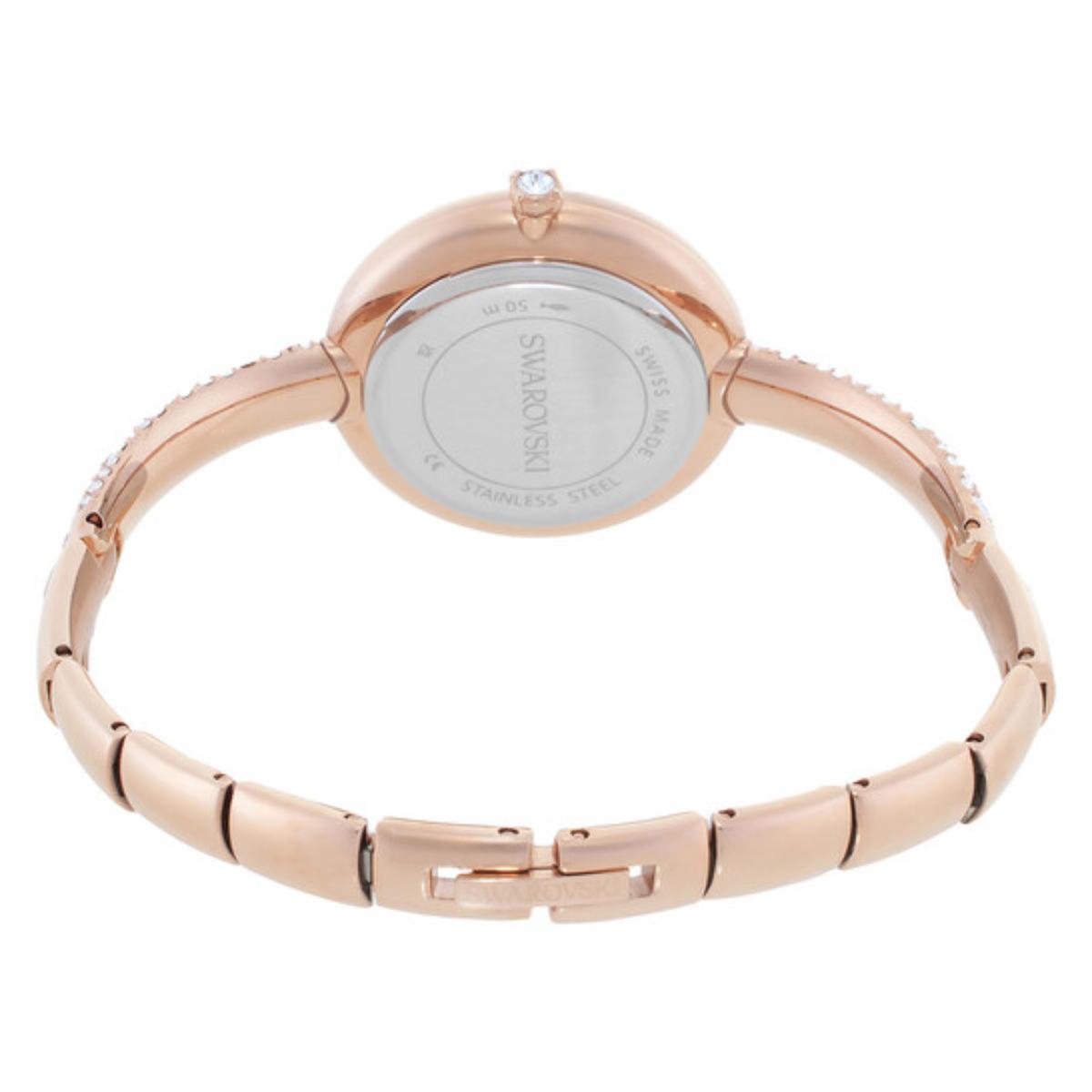 Rose gold watch with a white face on a white background
