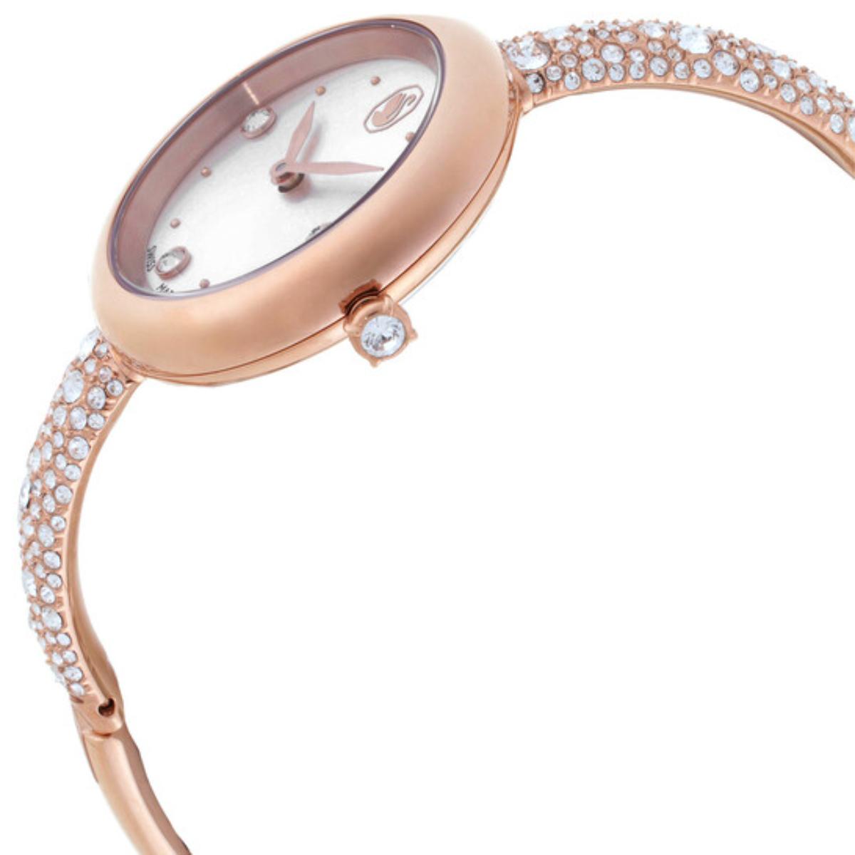 Rose gold watch with crystal embellishments on a white background