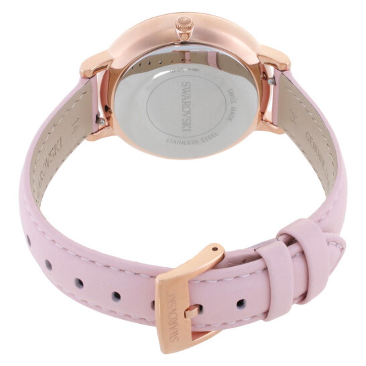 Watch with pink strap and rose gold case on a white background
