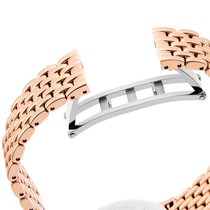 Rose gold and silver watch band on a white background