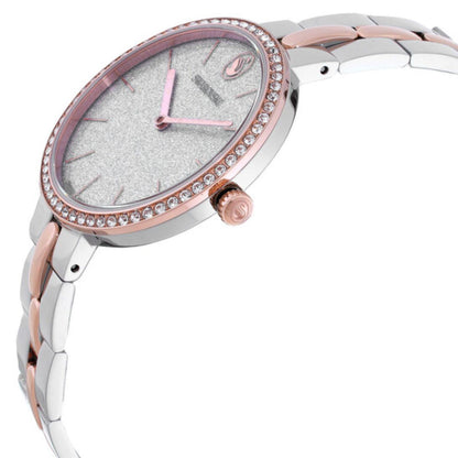Silver and rose gold watch with a white face on a white background