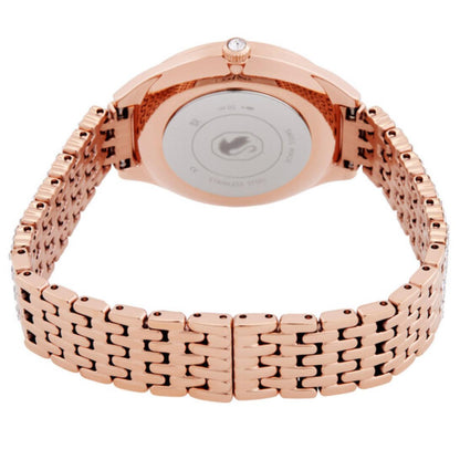Rose gold watch with a white face on a white background