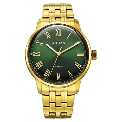 Gold wristwatch with a green dial and Roman numerals on a white background