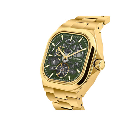 Gold wristwatch with a green face on a light gray background