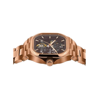 Rose gold watch with detailed face on a light gray background