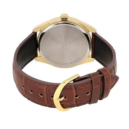 Watch with brown leather strap and gold buckle on a white background