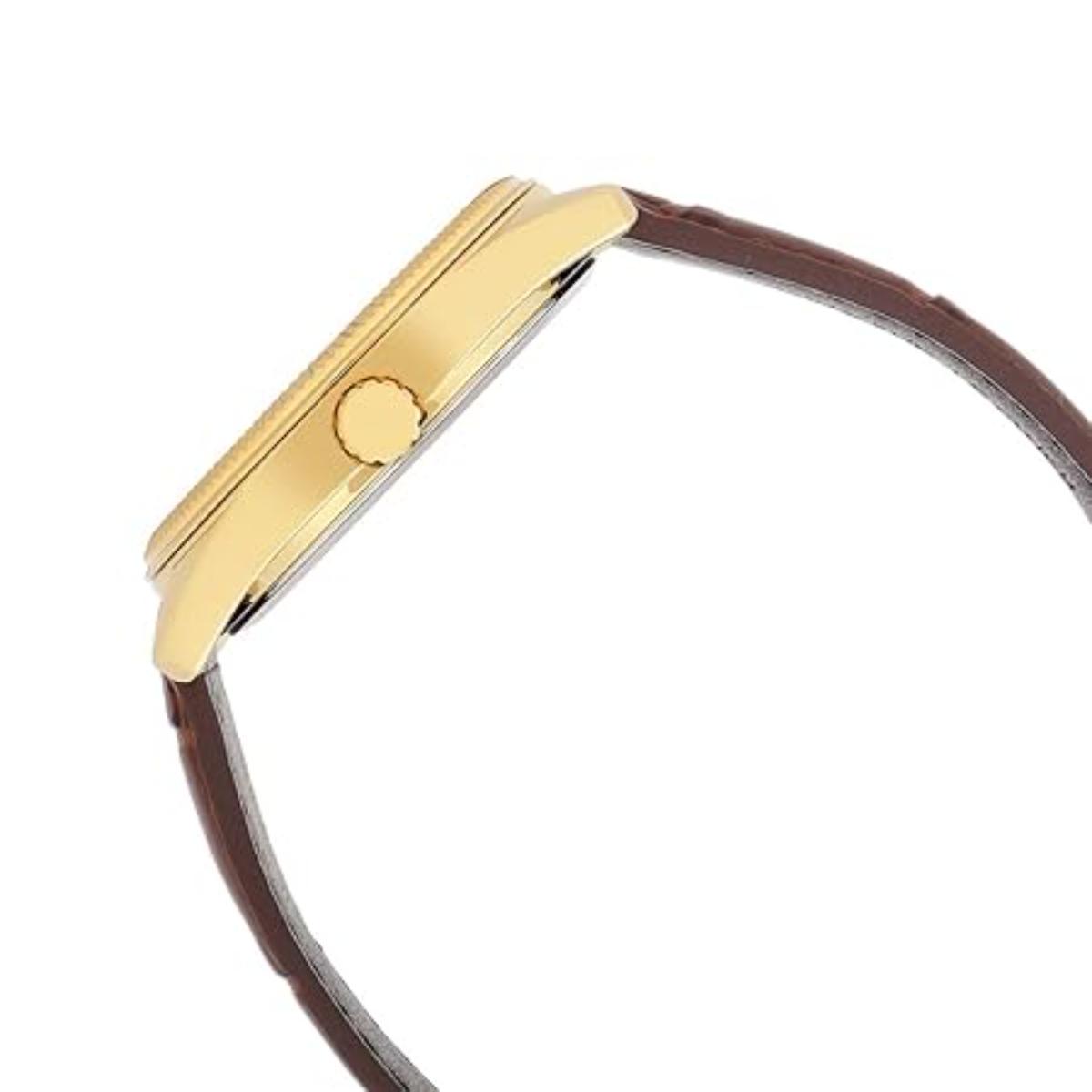 Gold watch case with brown leather strap on a white background