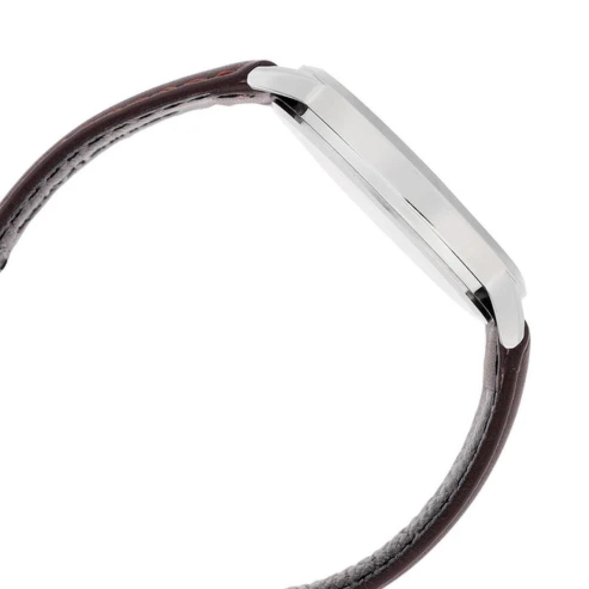 Silver bracelet with brown leather strap on a white background