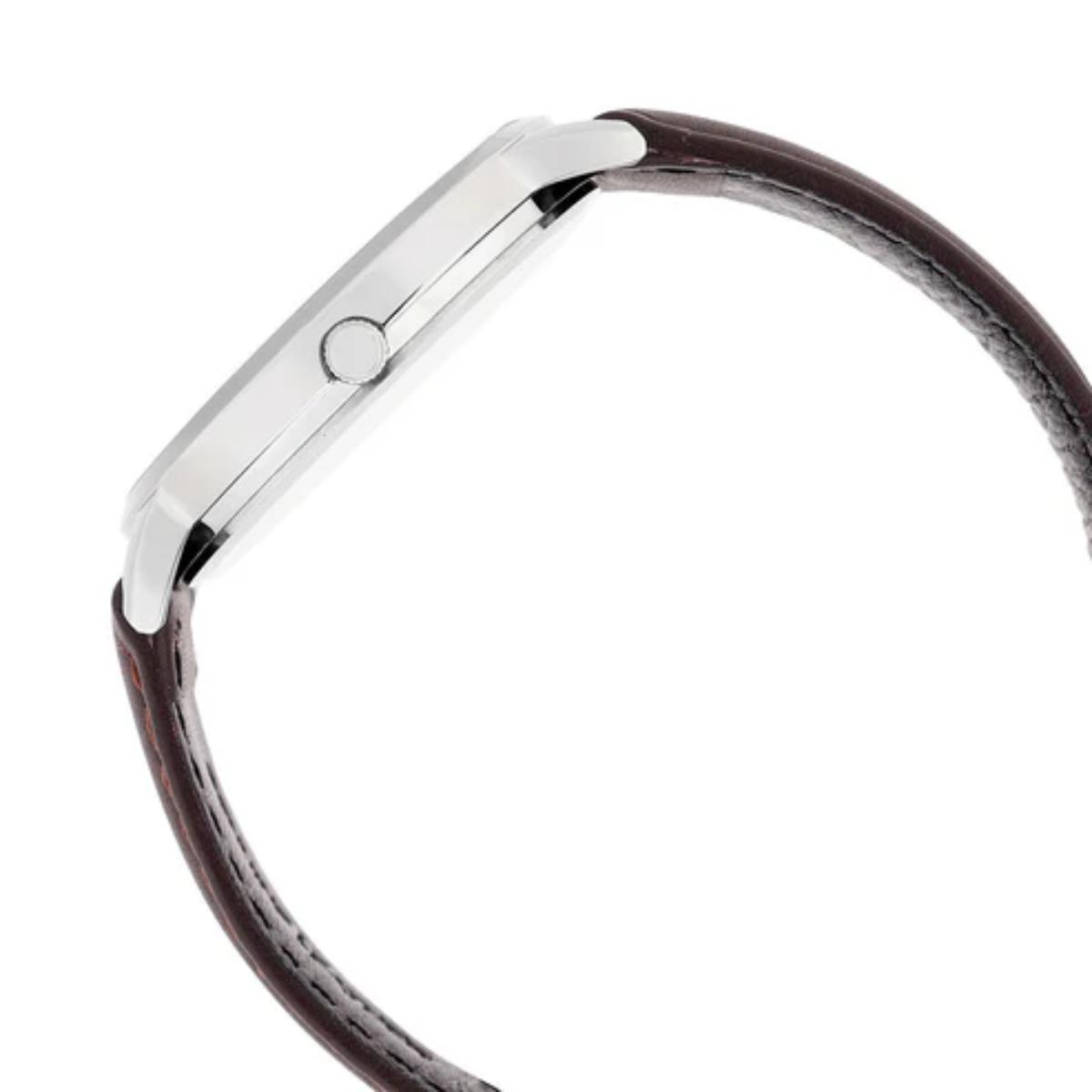 Close-up of a silver watch band with brown leather strap on a white background