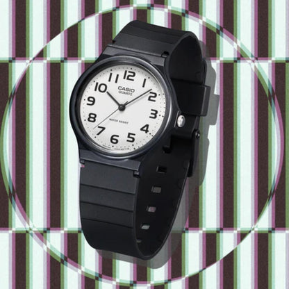 Black Casio watch on a multicolored striped background