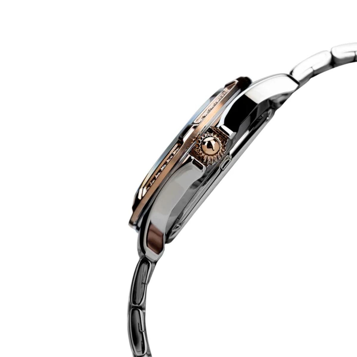 Close-up of a silver watch with a white background