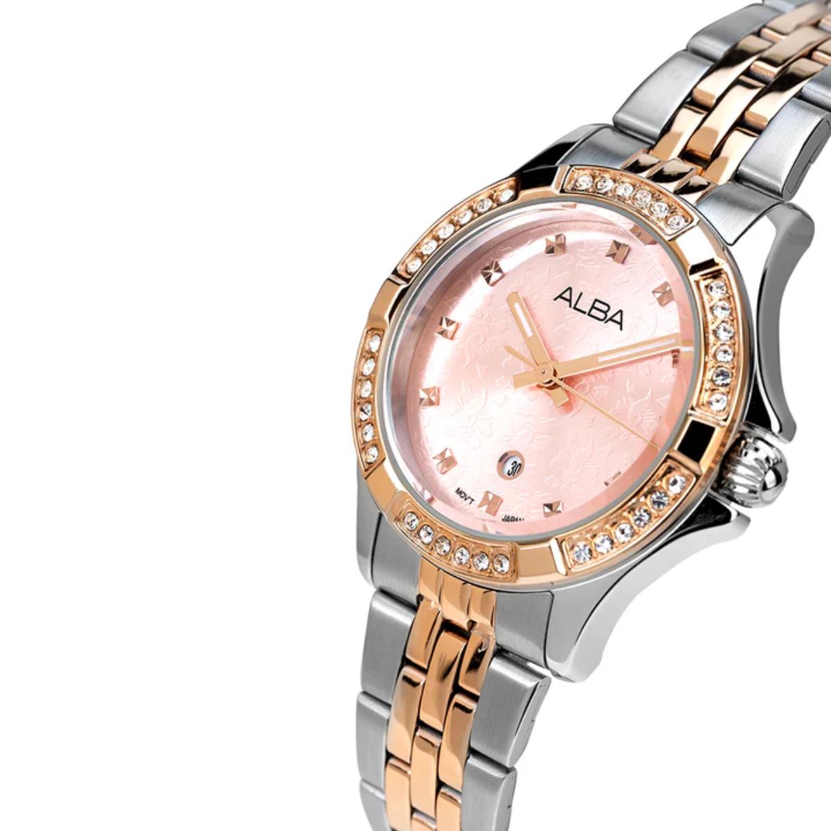 Two-tone watch with pink face and 'Alba' branding on a white background
