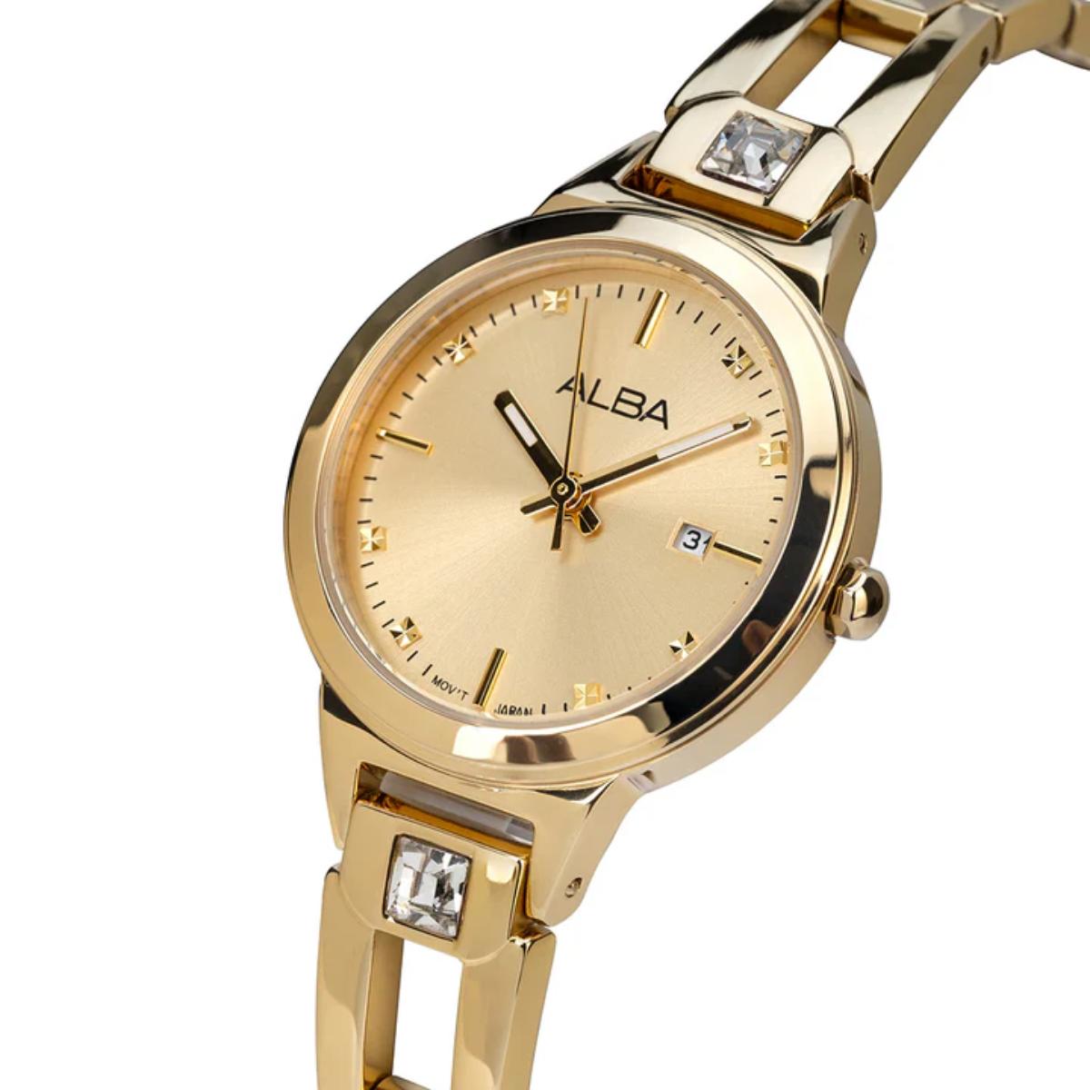 Gold watch with diamond accents on a white background