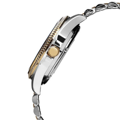 Close-up of a watch with a gold and silver band on a white background