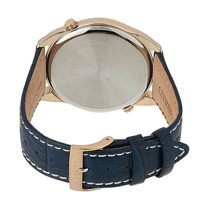 Watch with blue strap and rose gold case on a white background