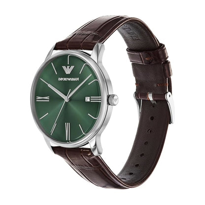 Watch with green dial and brown leather strap on a white background