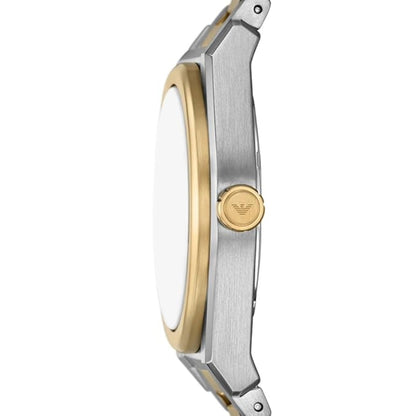 Close-up of a watch with a gold and silver band on a white background