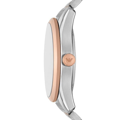 Close-up of a watch with silver and rose gold design on a white background