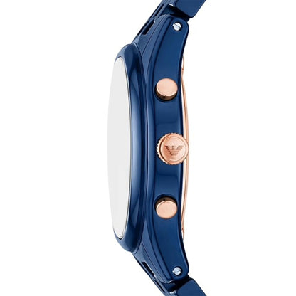 Close-up of a blue watch with rose gold accents on a white background