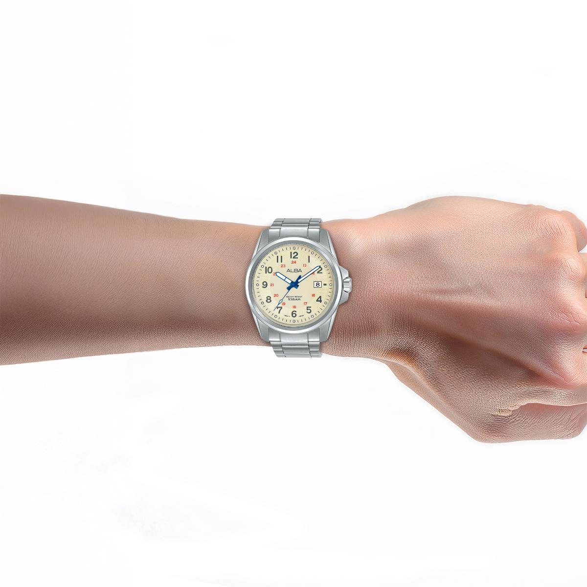 Silver watch on a wrist with a white background