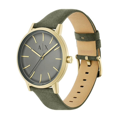 Watch with green strap and gold case on white background