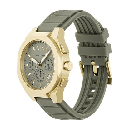 Watch with gold case and green silicone strap on a white background