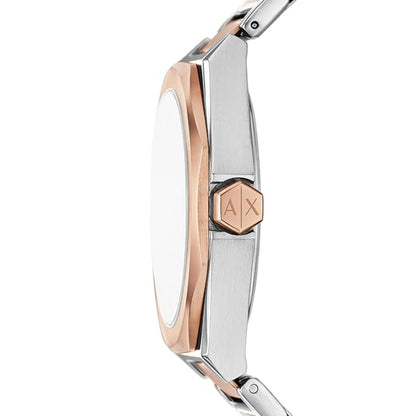 Close-up of a silver and rose gold watch with Armani Exchange logo.