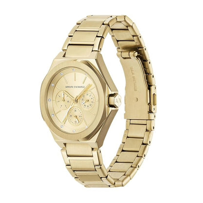 Gold watch with a detailed face on a white background