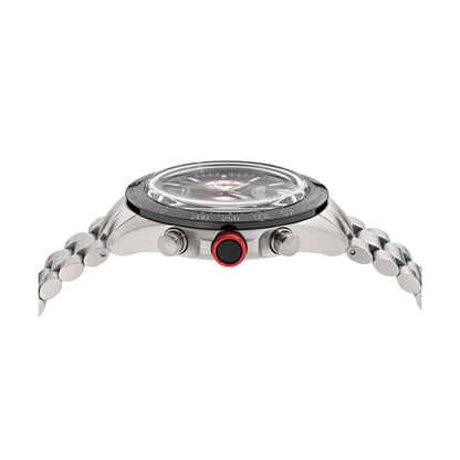 Close-up of a silver watch with a red button on a white background