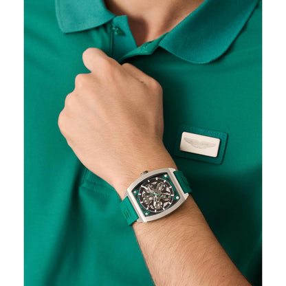 Person wearing a green watch with a visible brand logo on a green shirt.