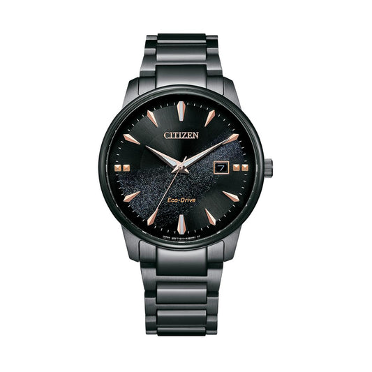 Citizen watch with black face and rose gold accents on a white background