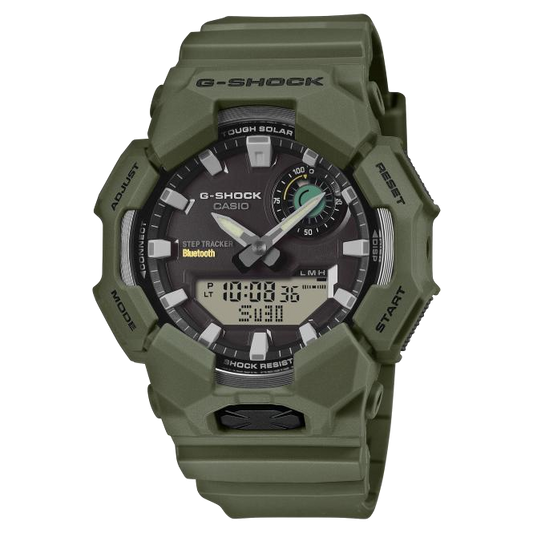 Green G-Shock watch with digital and analog display on a white background