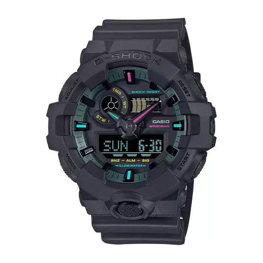 A Casio G-SHOCK GA-700MF-1ADR analog-digital men's watch with a black band and bezel, featuring vibrant fluorescent color accents in blue, pink, and yellow on the dial.