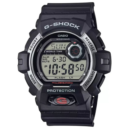 A black Casio G-SHOCK watch with a digital display, signature red accents, and a stainless steel bezel.