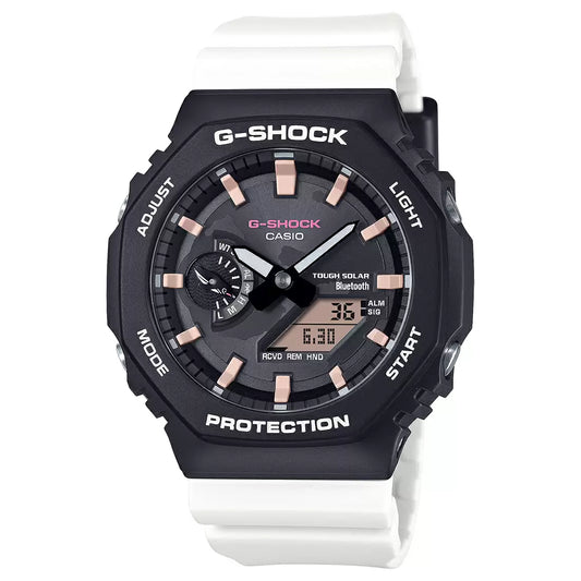 A Casio G-SHOCK watch with a black case and white band, featuring a digital display and analog hands.