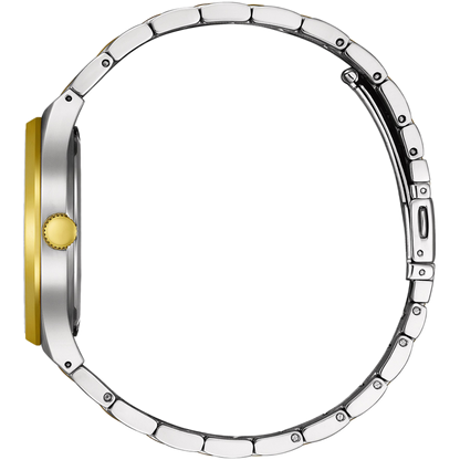 Close-up of a silver watch case with a gold accent on a white background