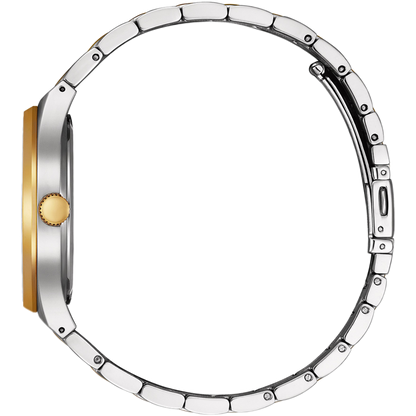 Close-up of a silver and gold watch face on a white background