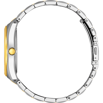 Close-up of a silver and gold watch face on a white background