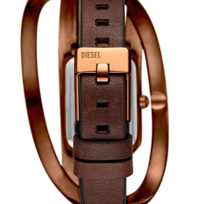 Close-up of a Diesel watch with brown leather strap and rose gold accents on a white background