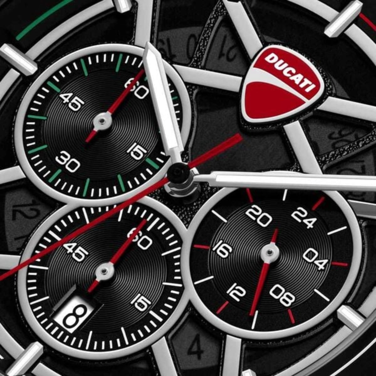Close-up of a Ducati branded watch with multiple dials.