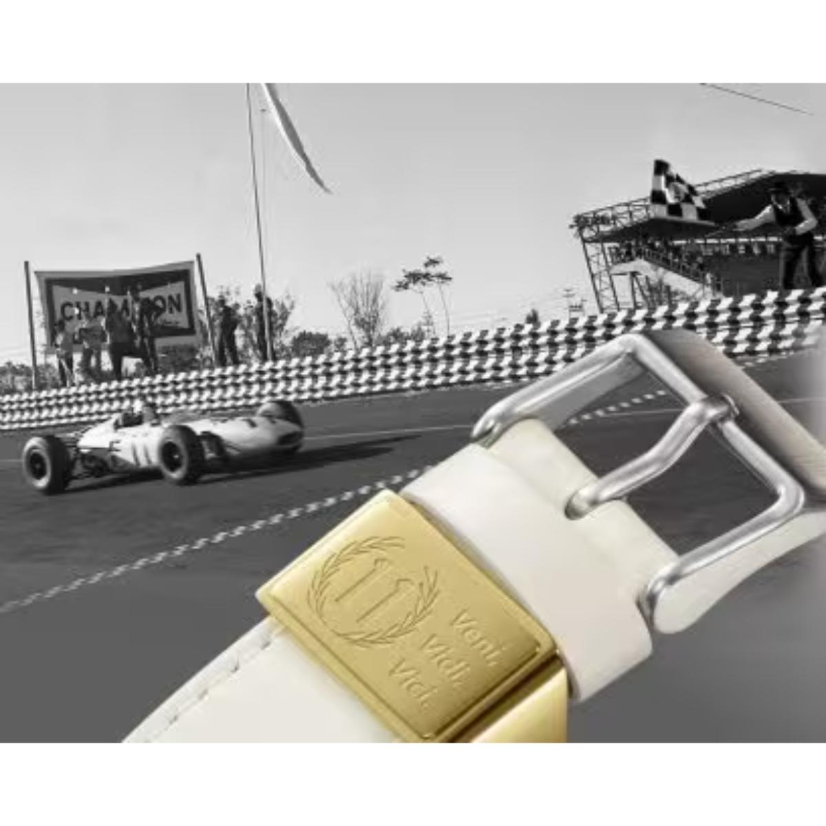 Vintage racing car on a track with a white belt featuring a gold buckle overlay.
