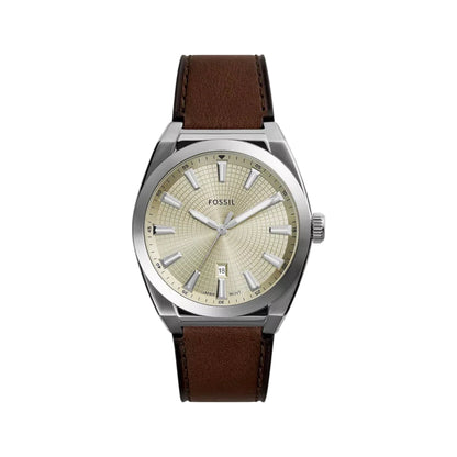Fossil watch with brown leather strap and beige dial on a white background