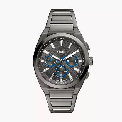 Fossil watch with metallic band and detailed face on a white background
