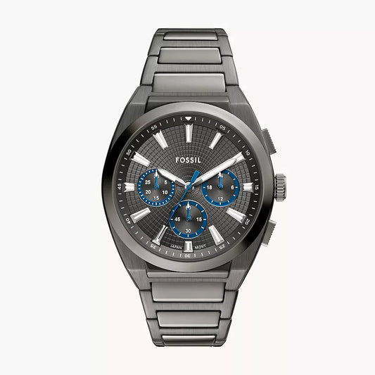 Fossil watch with metallic band and detailed face on a white background