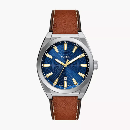 Fossil watch with brown leather strap and blue dial on white background