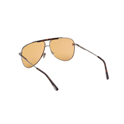 Aviator sunglasses with gold lenses and tortoiseshell frame on a white background